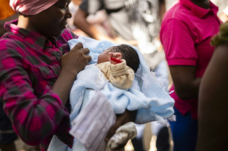 First-time mother Nehemie Laguerre, 20, with her newborn