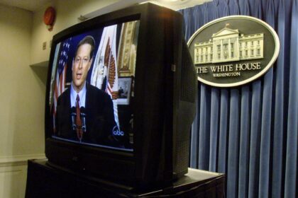 A television at the White House shows Al Gore giving his concession speech