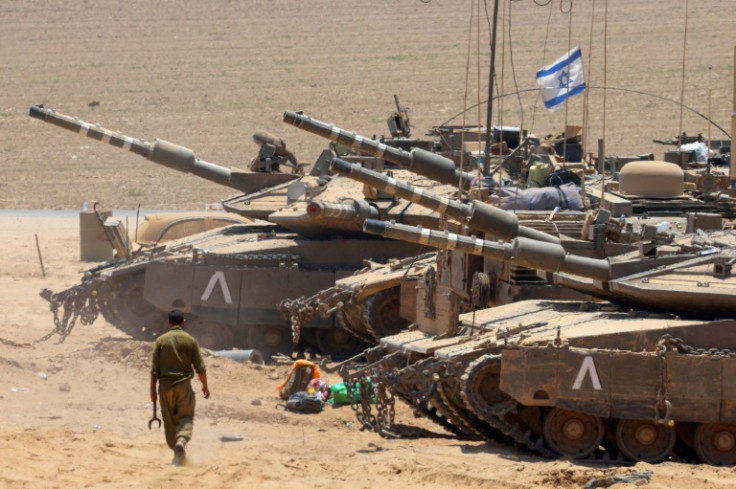 Israeli army tanks deploy near Israel's southern border with the Gaza Strip on July 9, 2024