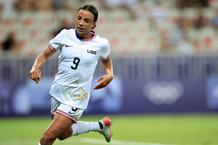 Mallory Swanson scored two goals in two minutes as the United States beat Zambia 3-0 in Nice