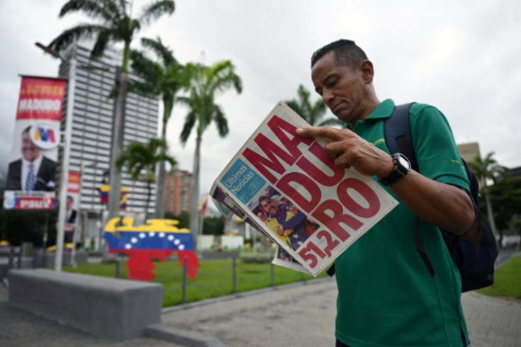 A man reads a newspaper in Caracas on July 29, 2024, a day after the Venezuelan presidential election