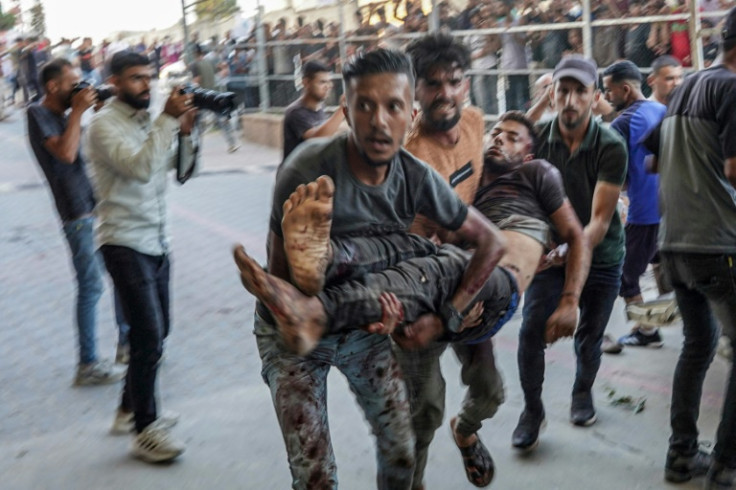 A man wounded during Israeli bombardment is carried to the emergency ward of Nassr hospital in Khan Yunis in the southern Gaza Strip on July 9, 2024