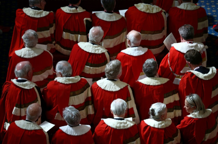 Members of the House of Lords wore red and ermine robes