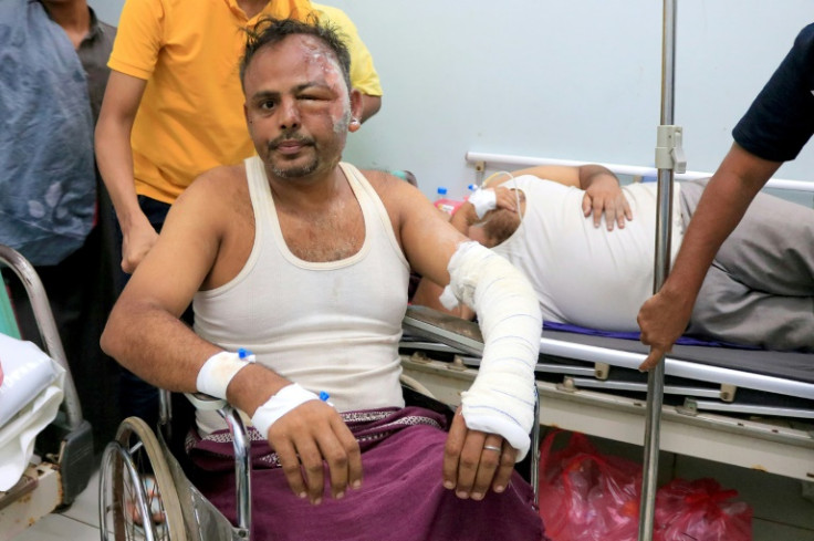 Men injured in an Israeli strike on Yemen's Huthi rebel-held port city of Hodeida receive treatment at a hospital