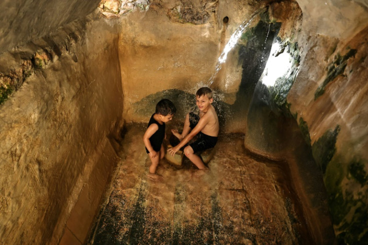 Palestinian children play in Battir's Roman-era fountain