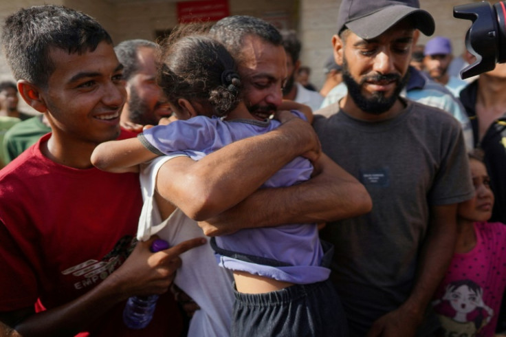 A Palestinian man who had been detained by Israel arrives at a central Gaza hospital after his release