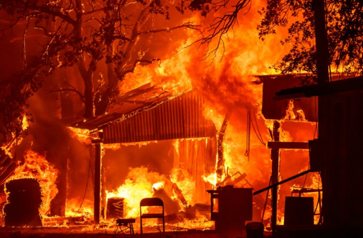 A property is seen in flames as the Park Fire burns near Paynes Creek, California on July 26, 2024