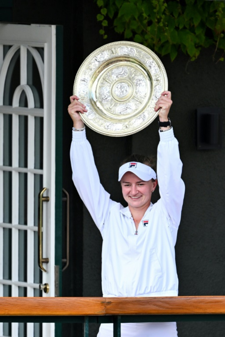 Queen of Centre Court: Barbora Krejcikova holds the Venus Rosewater Dish