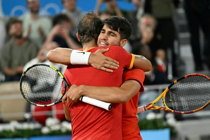 Spain's Rafael Nadal (left) and Spain's Carlos Alcaraz embrace after their doubles debut