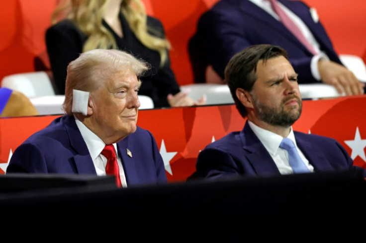 Trump, his ear bandaged after the assassination attempt, sits next to newly-announced running mate J.D. Vance at the Republican National Convention