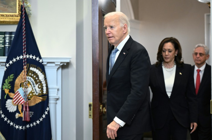 US President Joe Biden, Vice President Kamala Harris, and Attorney General Merrick Garland arrive in the Roosevelt Room of the White House in Washington, DC, on July 14, 2024.  Biden spoke one day after former president Donald Trump survived an apparent a