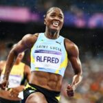 Saint Lucia's Julien Alfred celebrates after winning the women's 100m at the Paris Olympics