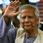 Nobel laureate and chief adviser of Bangladesh's new interim government, Muhammad Yunus greets the public after laying a wreath at the National Martyrs' Memorial in Dhaka on August 9