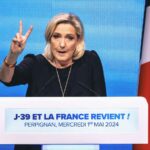 Marine Le Pen at the podium of the Rassemblement National meeting at the Palais des Congres in Perpignan in the French department of Pyrenees-Orientales on May 1, 2024.