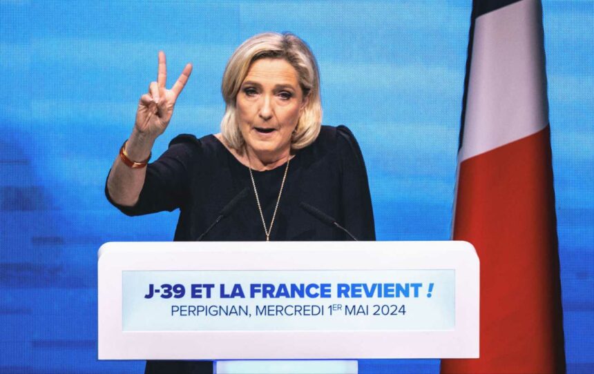 Marine Le Pen at the podium of the Rassemblement National meeting at the Palais des Congres in Perpignan in the French department of Pyrenees-Orientales on May 1, 2024.