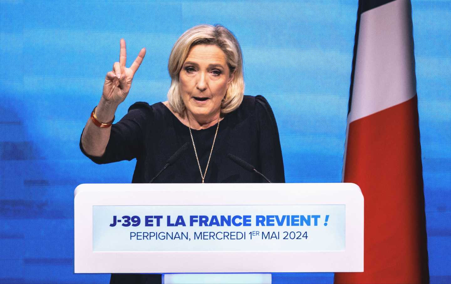 Marine Le Pen at the podium of the Rassemblement National meeting at the Palais des Congres in Perpignan in the French department of Pyrénées-Orientales on May 1, 2024.