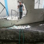 An unexploded ordnance is seen in a damaged UNRWA school, in which Palestinians took shelter after the building was hit during Israel