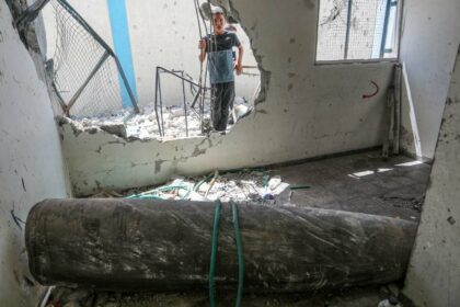 An unexploded ordnance is seen in a damaged UNRWA school, in which Palestinians took shelter after the building was hit during Israel