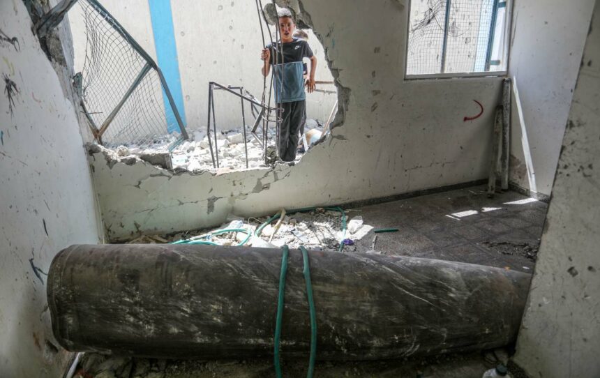 An unexploded ordnance is seen in a damaged UNRWA school, in which Palestinians took shelter after the building was hit during Israel