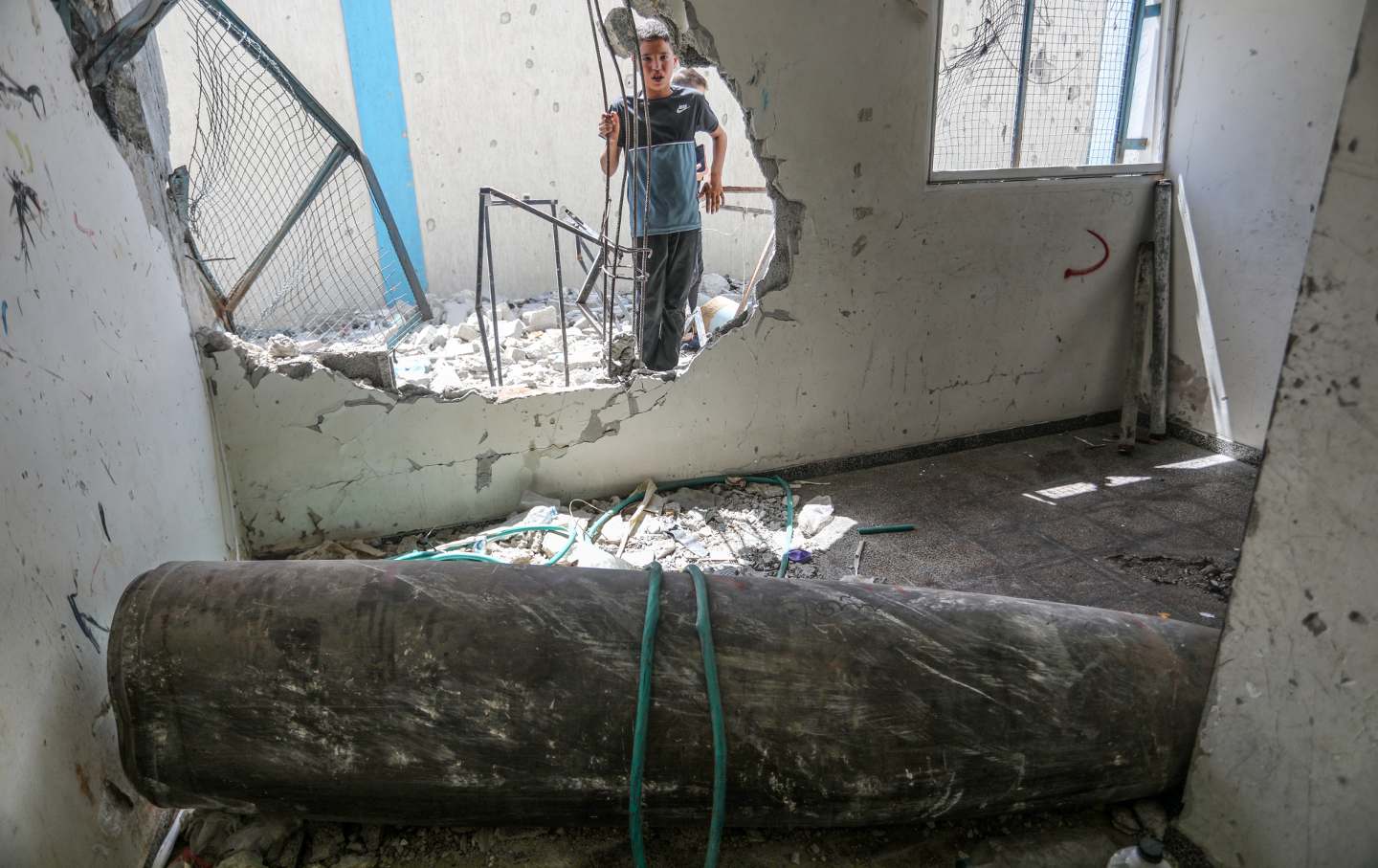 An unexploded ordnance is seen in a damaged UNRWA school, in which Palestinians took shelter after the building was hit during Israel's assaults, in Khan Yunis, Gaza on June 14, 2024.