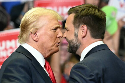 Former US President Donald Trump greets US Senator and vice presidential nominee J.D. Vance as they attend their first campaign rally together.