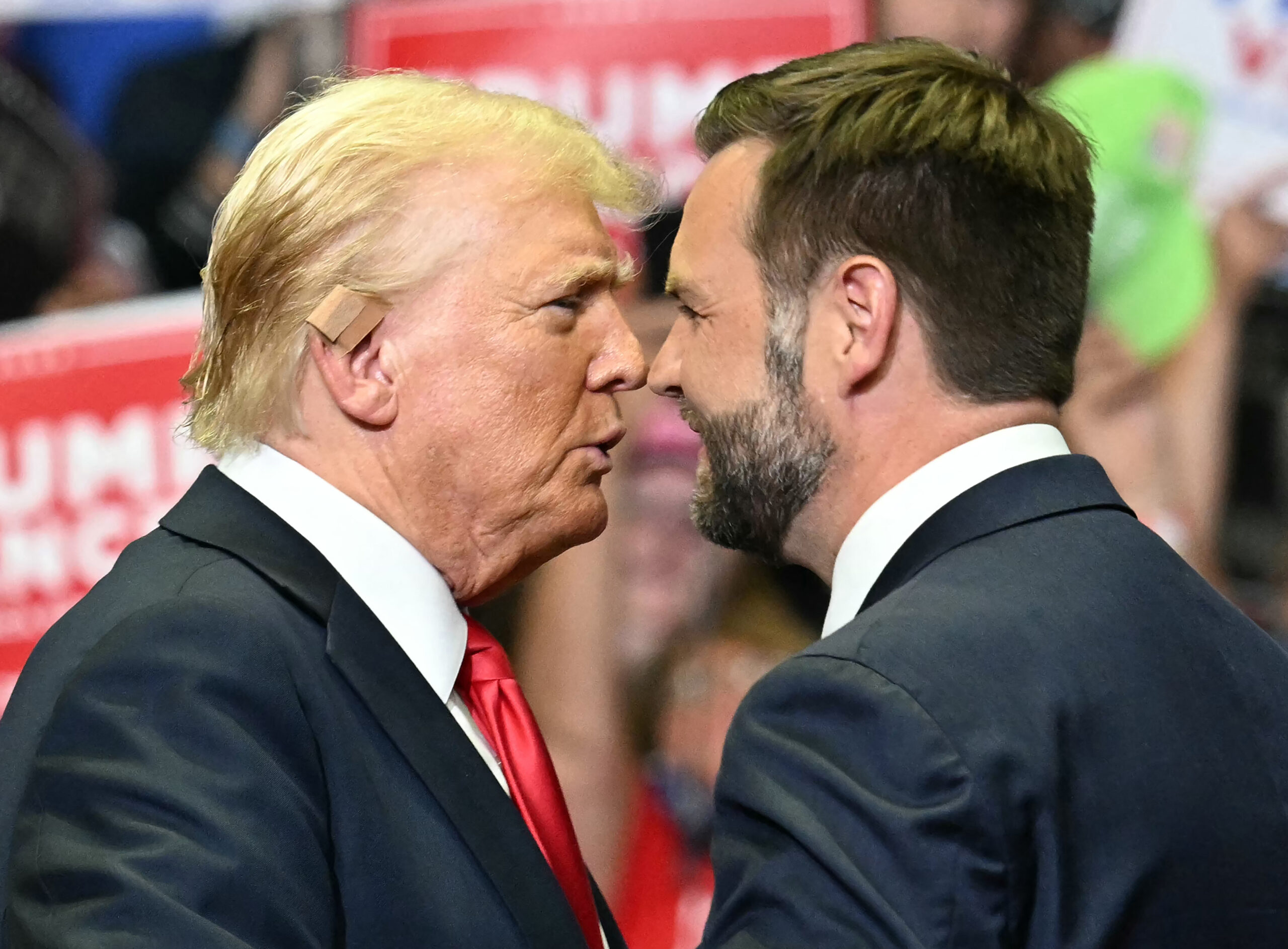 Former US president Donald Trump greets US Senator and vice presidential nominee J.D. Vance as they attend their first campaign rally together.