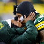 Simone Biles kisses husband Jonathan Owens before an NFL game between the Green Bay Packers and Kansas City Chiefs