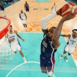 LeBron James dunks as the USA take on France for the men's basketball gold