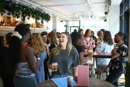 People attend 'The Girlies Club', a speed-dating-style networking event that brings together people looking for rental flatmates in London