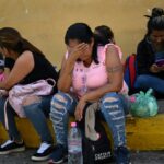 Relatives of people arrested during Venezuela's post-election protests wait for news outside of the Bolivarian National Police (PNB) Detention Centre