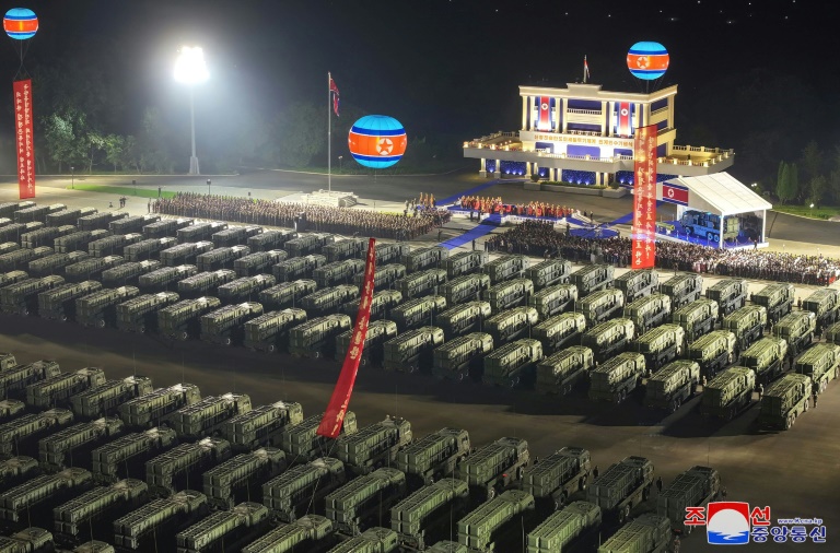 A photo released by North Korean state media shows what are reportedly ballistic missile launchers being sent to troops on the border