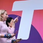 Telstra takes 13pct profit hit on one-off charges