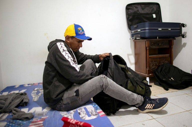 Colombia-based Venezuelan migrant Jose Ochoa packs his belongings as he prepares to travel to the United States via the dangerous Darien Gap