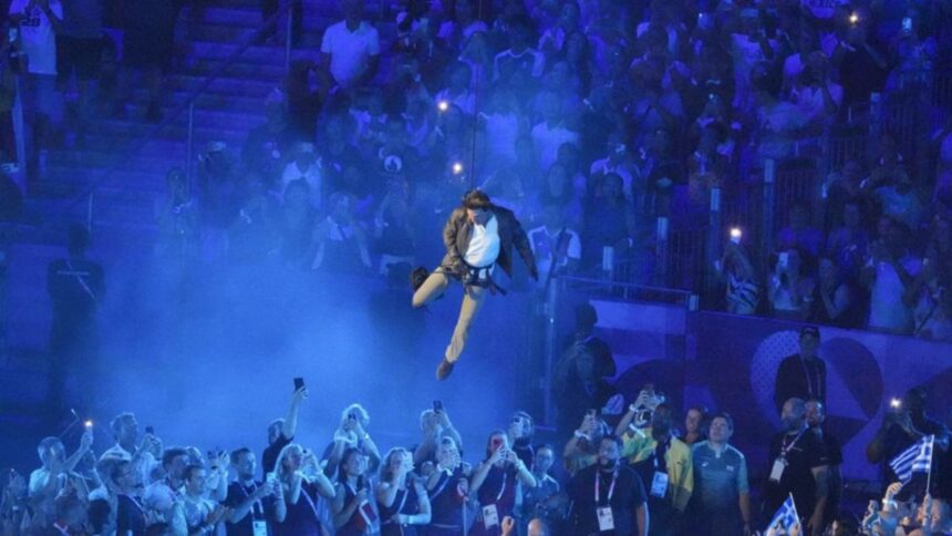 Tom Cruise performs abseiling stunt to close Olympics