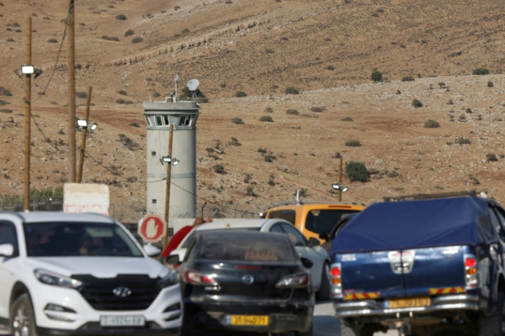 Cars held up at an Israeli checkpoint in the occupied West Bank following a deadly shooting attack