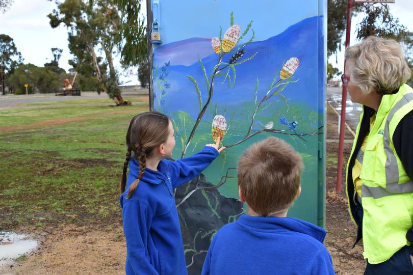 Cranbrook Primary School students Isabelle Tomlinson, 8, and Charlie Dixon, 7, with Water Corporation project manager Claire Camplin. 