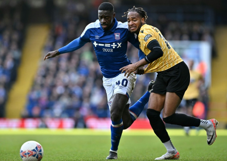 Ipswich defender Axel Tuanzebe (L)