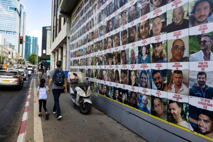 Posters of hostages held by Gaza militants since the October 7 attack on a street in Tel Aviv, Israel's commercial hub