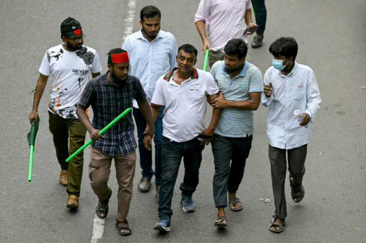 Several people the crowd suspected of being Awami League supporters were thrashed with sticks, while others were forcibly escorted away