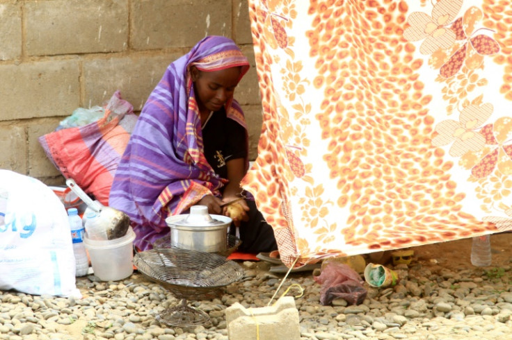 Sudanese civilians, already displaced by conflict, were evacuated to a makeshift campsite following deadly floods in Kassala