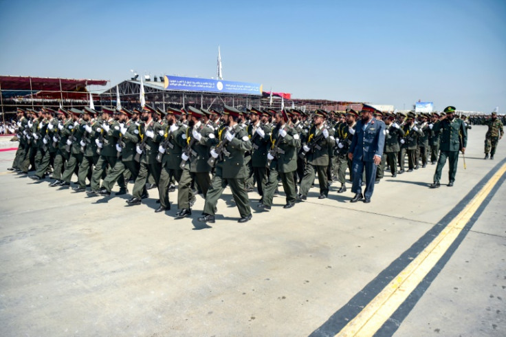 Taliban security personnel take part in a military parade at the former Bagram Air Base to celebrate the third anniversary of the Taliban's takeover of Afghanistan