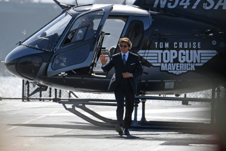 US actor Tom Cruise arrives in a helicopter for the world premiere of 'Top Gun: Maverick!' aboard the USS Midway in San Diego, California on May 4, 2022 -- the sequel was his biggest hit to date