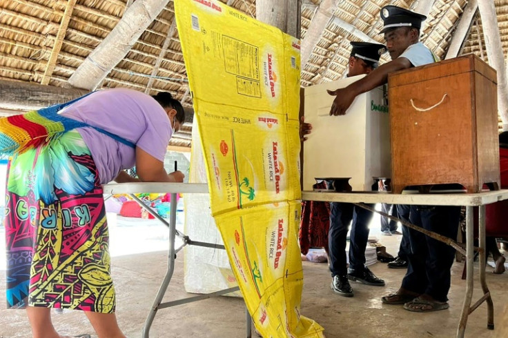 A woman votes at a polling station in Tarawa on August 14, 2024. Polls opened in the Pacific nation of Kiribati