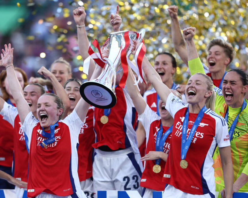 Arsenal players in red and white celebrating Champions League final victory in Lisbon