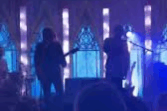 Screenshot from Royel Otis music video “Moody” showing emotional expression and dim blue lighting