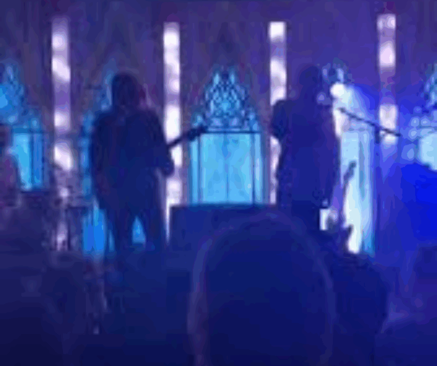Screenshot from Royel Otis music video “Moody” showing emotional expression and dim blue lighting