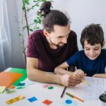 A general practitioner consulting with a young patient about ADHD treatment options in a clinical setting.