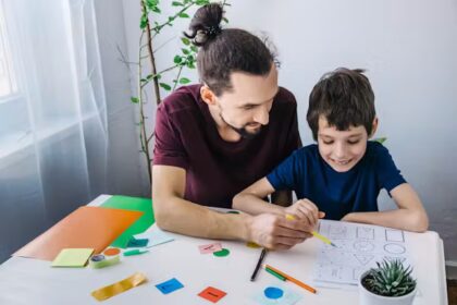 A general practitioner consulting with a young patient about ADHD treatment options in a clinical setting.