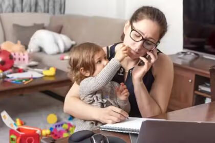 Parent sitting with autistic child, both appearing emotionally overwhelmed, showing the weight of caregiving.