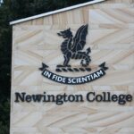 Newington College campus with coeducation announcement banner